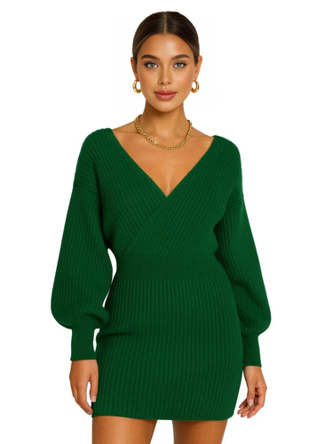 Mini green sweater dress worn by a model on a white background